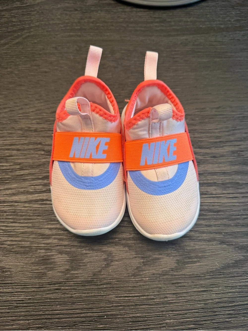 Nike Kids Slip-On Sneakers in Pink with Orange Strap and Blue Accent